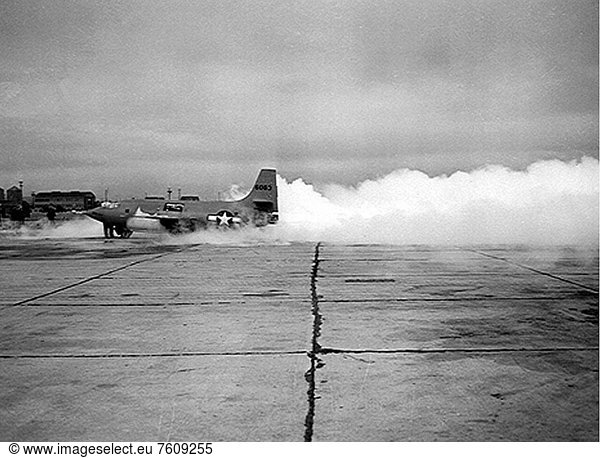 Ground engine test run on the Bell Aircraft Corporation X_1_2 airplane at NACA Muroc Flight Test Unit service area. Notice the front on the lower part of the aircraft aft of the nose section. The frost forms from the mixture of the propellants including liquid oxygen in the internal tanks. This photograph was taken in 1947. The aircraft shown is still painted in its original saffron orange paint finish. This was later changed to white  which was more visible against the dark blue sky than saffron turned out to be.