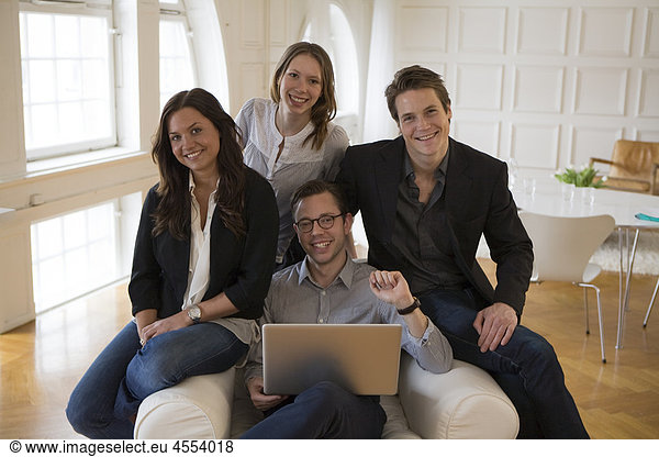 Group of businesspeople with laptop