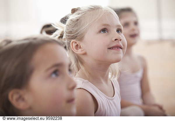 Group of girls looking up in ballet school