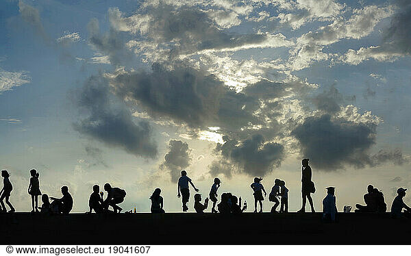 Group of people against sky at sunset  Manila  Philippines