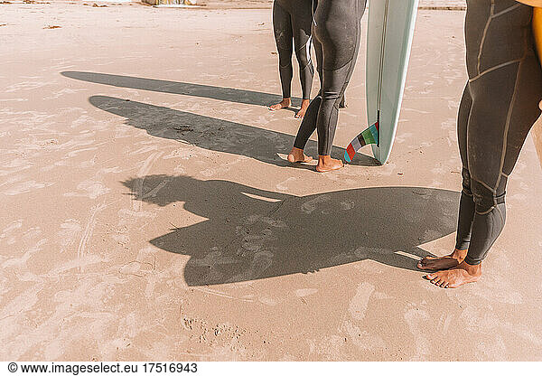 Group of women with surfboards at the beach