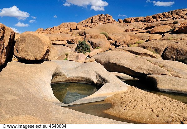 guelta waterhole in a granite landscape  Hoggar  Ahaggar Mountains  Wilaya Tamanrasset  Algeria  Sahara  North Africa
