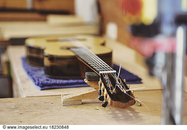 Guitar on workbench in workshop