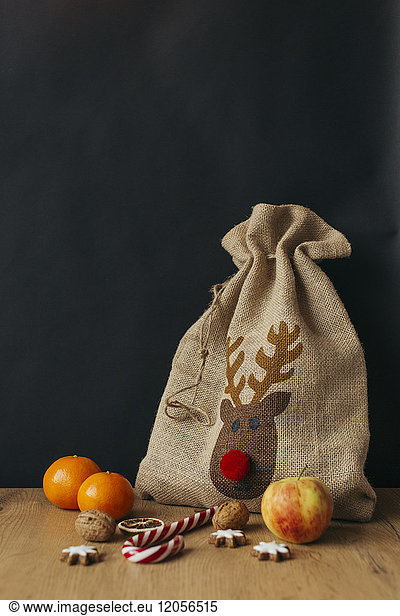 Gunny bag,  fruits,  candy cane,  walnuts and cinnamon stars