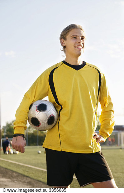 Guy posing with football
