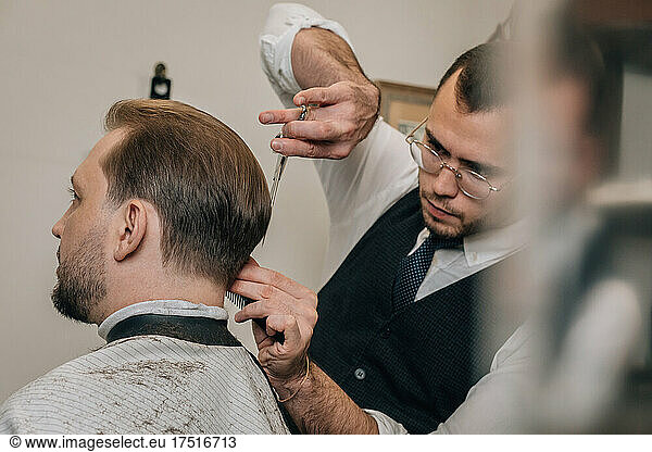 Hair cutter cuts hair  small business concept.