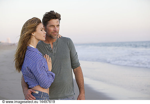 Half-Length Portrait of Mid-Adult Couple at Gazing at Ocean