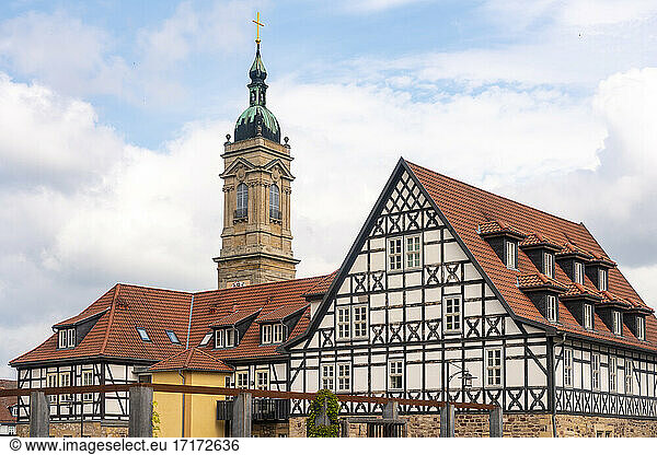 Half-timbered houses at Luther Square near St George Church against cloudy sky in Eisenach  Germany