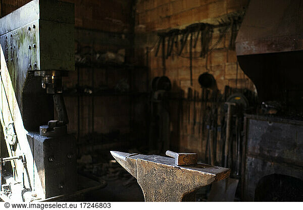 Hammer on anvil in blacksmith's shop