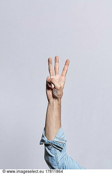 Hand counting number three  Man hand showing number three  Guy finger counting number three on isolated background