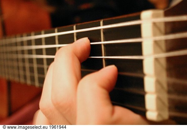Hand on guitar