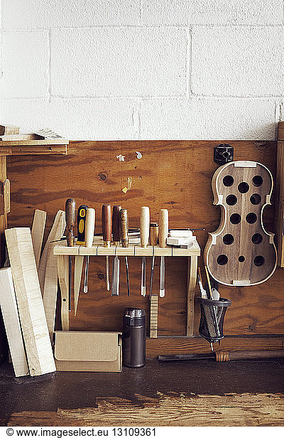Hand tools and wood hanging in workshop