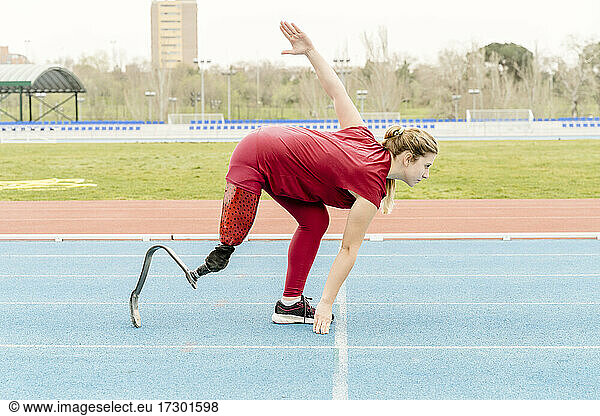 Handicapped runner during workout on stadium