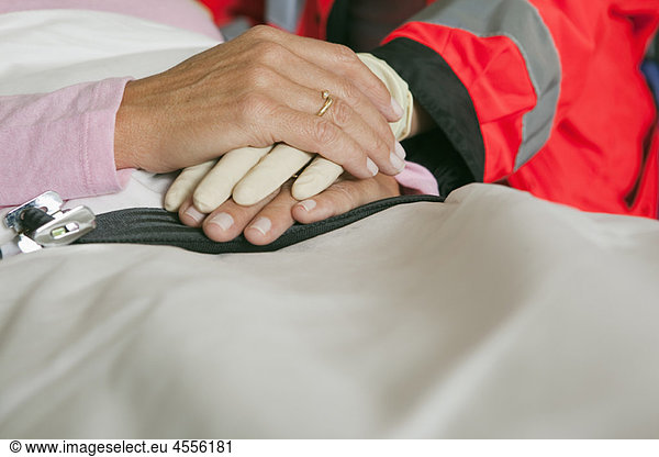 Hands of ambulance woman caring