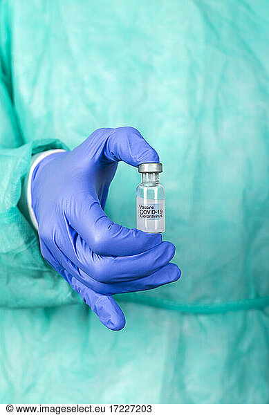 Hands of doctor holding Covid-19 vaccine
