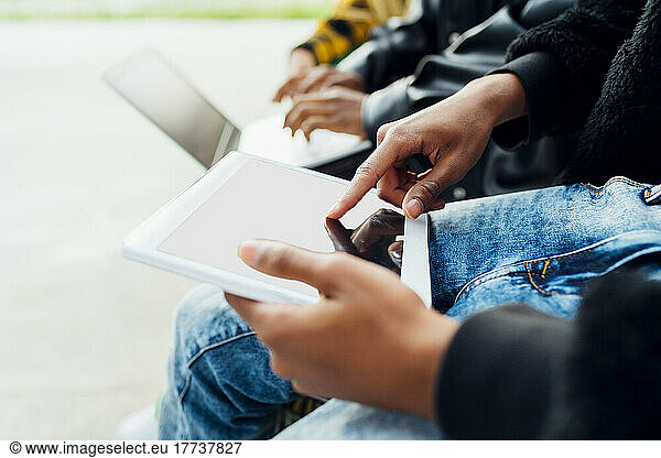 Hands of man using tablet PC