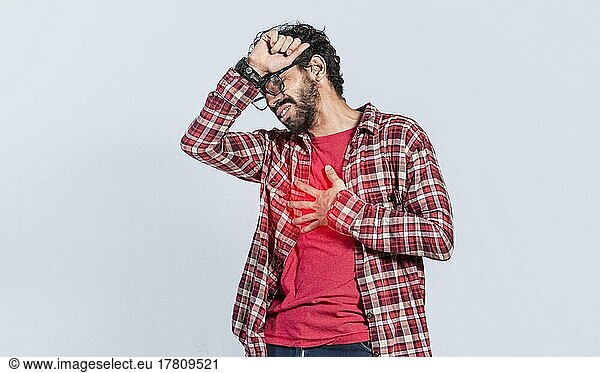 Handsome man with chest pain isolated  person with tachycardia  People with heart pain on isolated background  young man with chest pain isolated