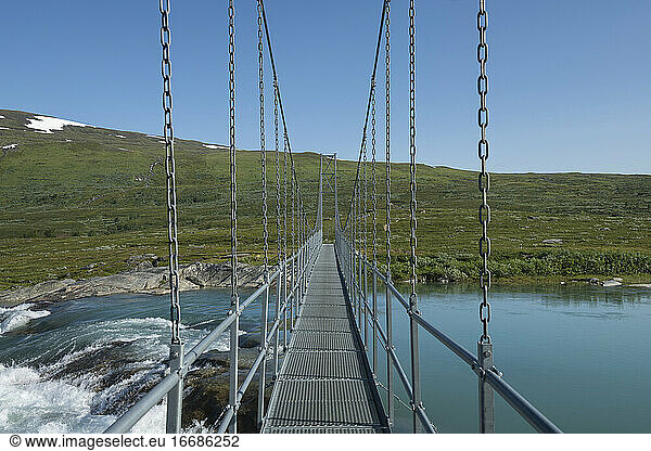 Hanging bridge Miellädno river along Padjelantaleden Trail  Padjelanta national park  Lapland  Sweden