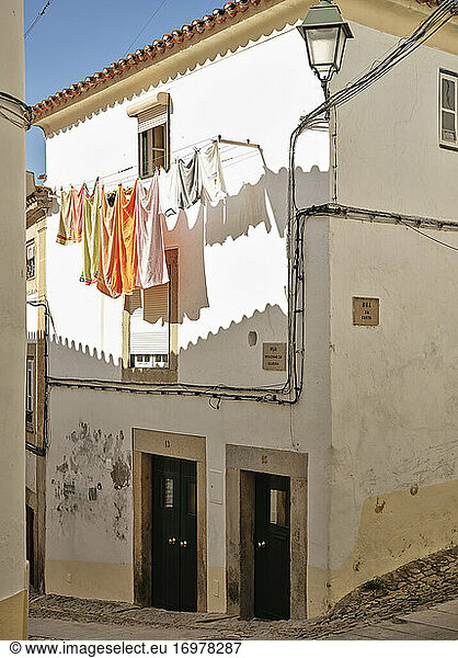 Hanging clotes on cobble stone street in Castelo De Vide