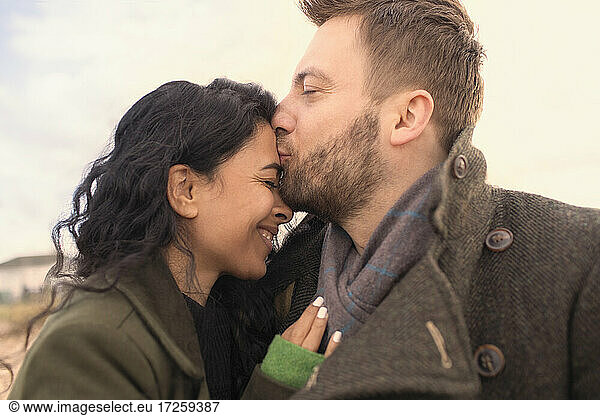 Happy affectionate couple kissing