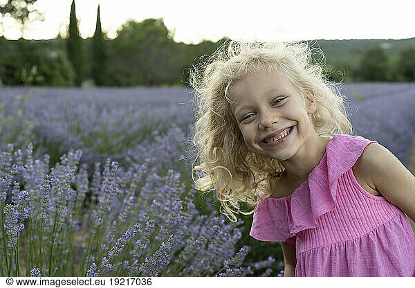 Happy blond girl in front of lavender field