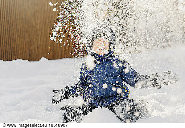 Happy boy enjoying in snow