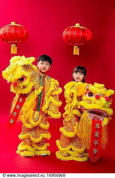 Happy boys and girls lion dance celebrating the New Year