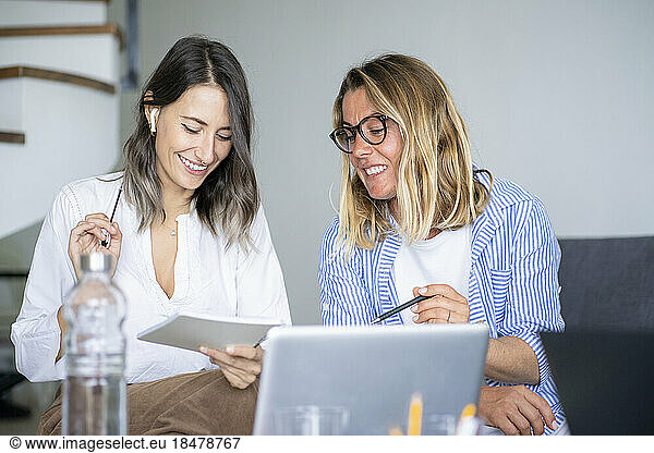 Happy businesswomen planning strategy working at home office