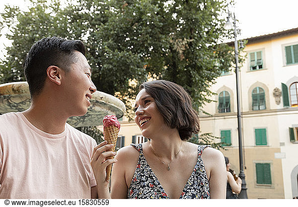 Happy couple enjoying Gelato in Florence Italy
