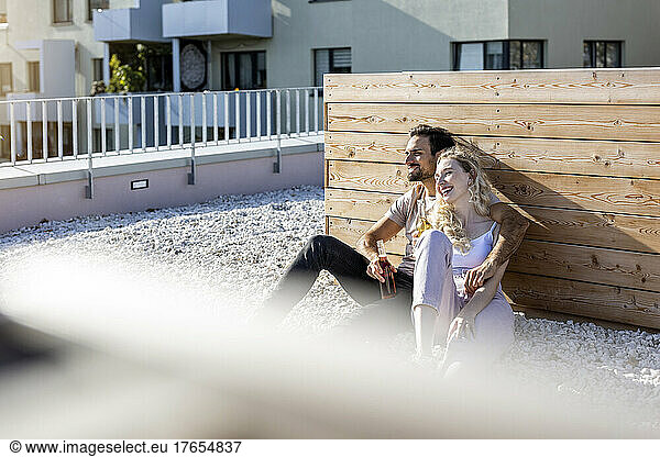 Happy couple enjoying together on terrace