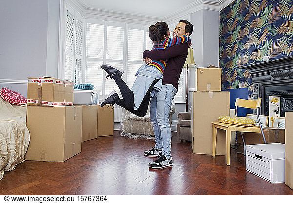Happy excited couple moving into new apartment