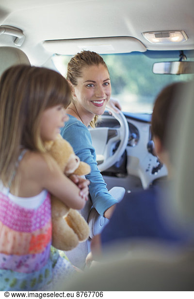 Happy family inside car