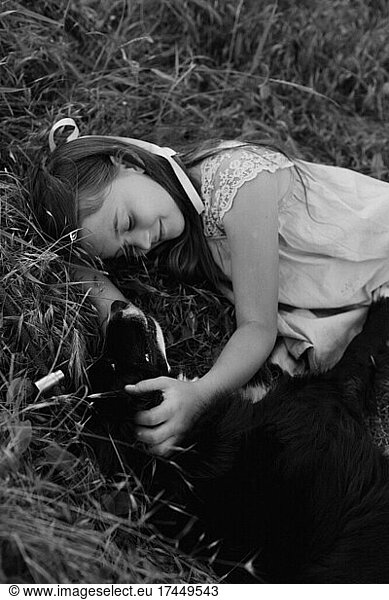 Happy girl hugging her dog outdoors. Lifestyles and pet care concept.