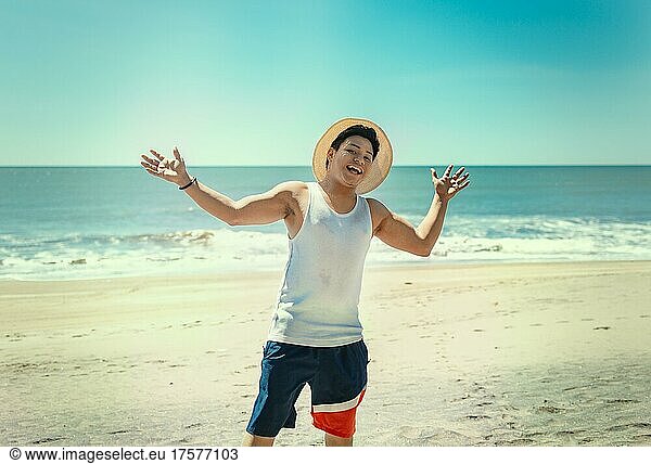 Happy handsome man on vacation outdoors  Happy latin young man on the beach  Tourist travel concept