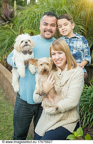 Happy mixed-race family portrait outdoors