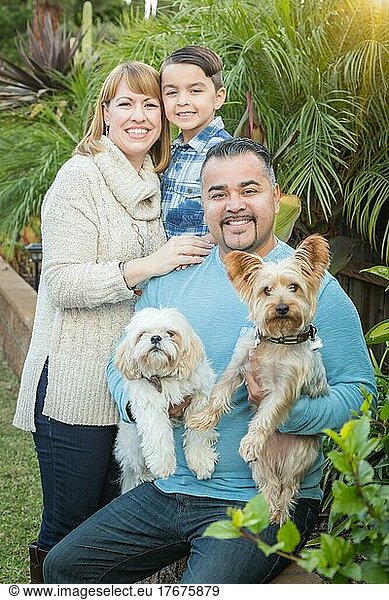 Happy mixed-race family portrait outdoors