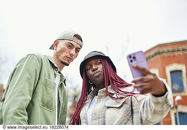 Happy Multiethnic Couple Taking Selfie