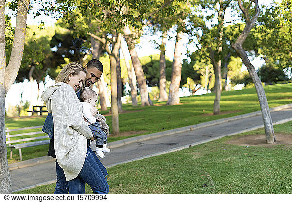 Happy parents spending a day in the park