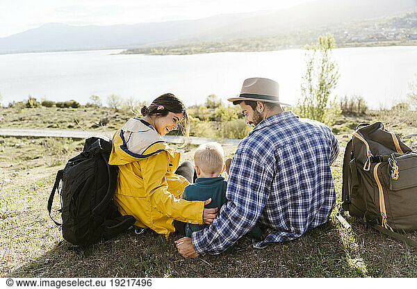 Happy parents spending leisure time with son on vacation