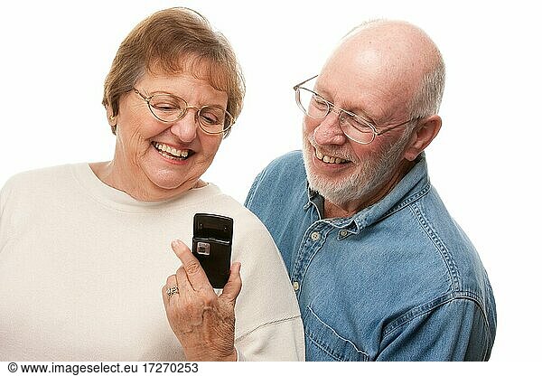 Happy senior couple using cell phone isolated on a white background