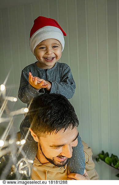 Happy son and father at home on Christmas