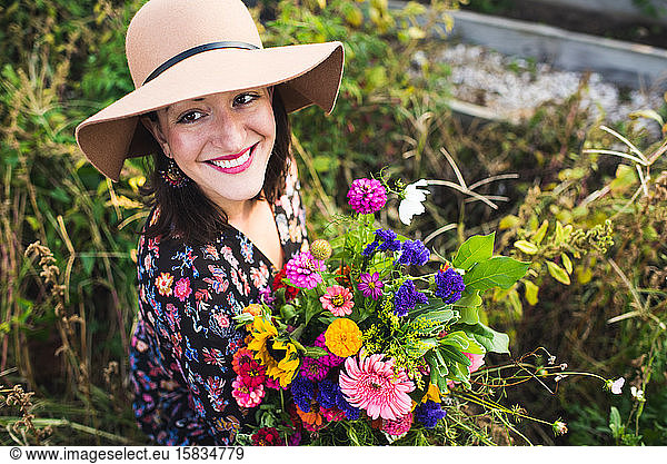 happy woman in an urban garden
