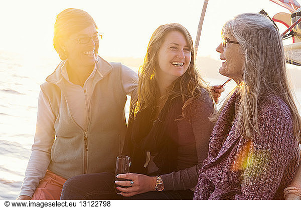 Happy women enjoying on boat in river