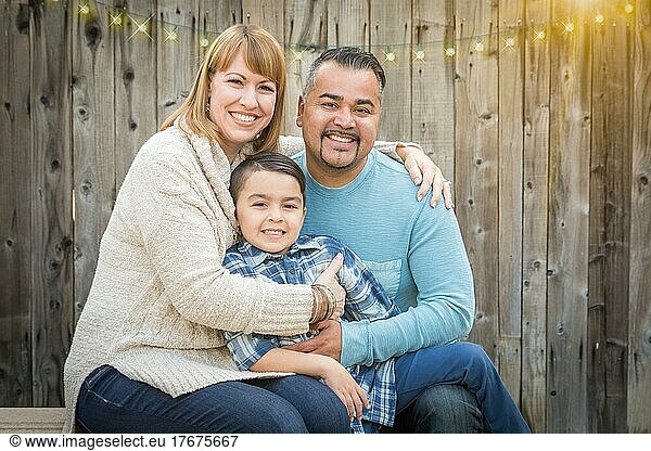 Happy young mixed-race family portrait outside