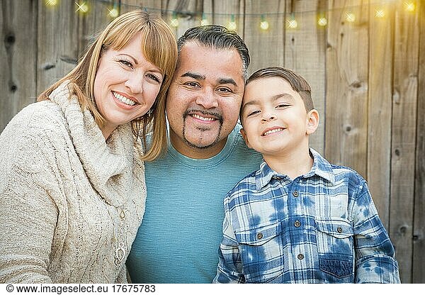 Happy young mixed-race family portrait outside