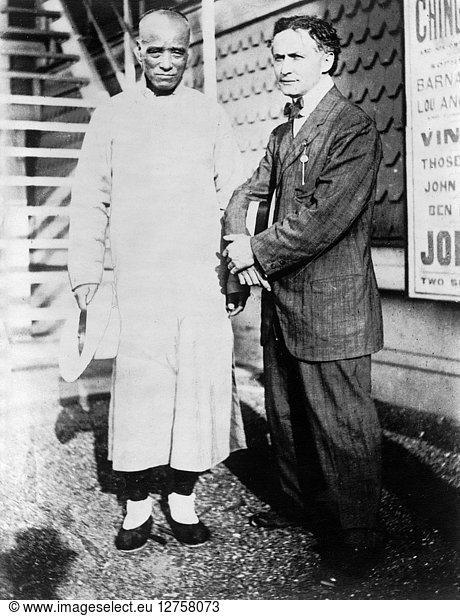 HARRY HOUDINI (1874-1926). American magician. Houdini (right) with Chinese magician Ching Ling Foo  at Brighton Beach  New York. Photograph  c1912.