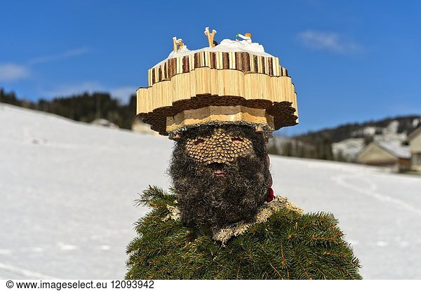 Head-dress of a Wood and Nature Chlaus decorated with scenes depicting country life  St Sylvester mummer at the Urnäsch Old Sylvester procession  Urnäsch  Canton Appenzell Ausserrhoden  Switzerland.