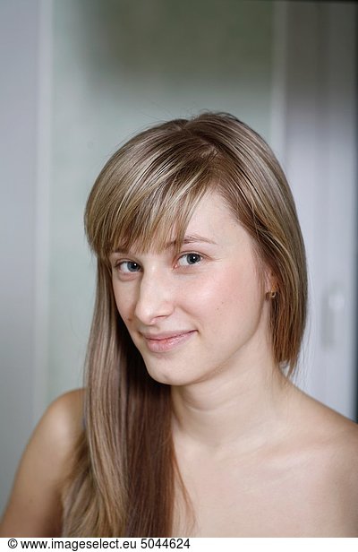 Headshot of a 24 year old blonde Caucasian woman indoors
