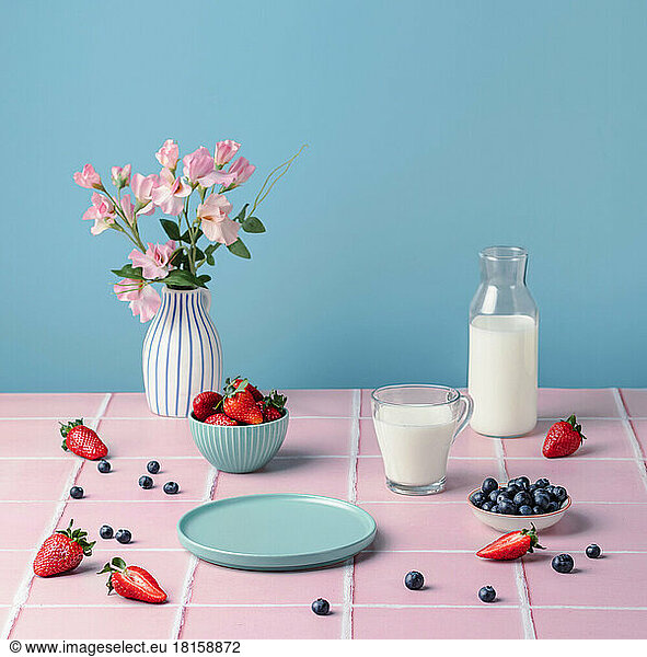 Healthy food. Table breakfast with berries strawberries glass of milk.