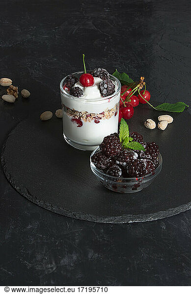 Healthy snack  yogurt cream with flakes  nuts and fruits for the